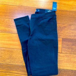 Black mid-rise super skinny jeans